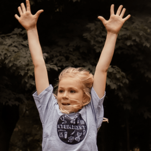 Young girl flexing her bicep muscles