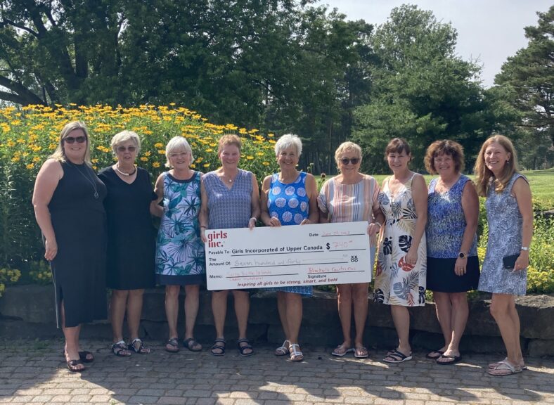 5 women in red dresses at the Girls Inc. 2019 Luncheon